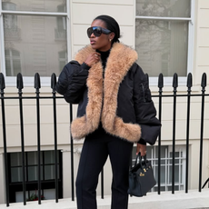 @nlmarilyn wearing a fur-trimmed coat with Tom Ford aviator sunglasses