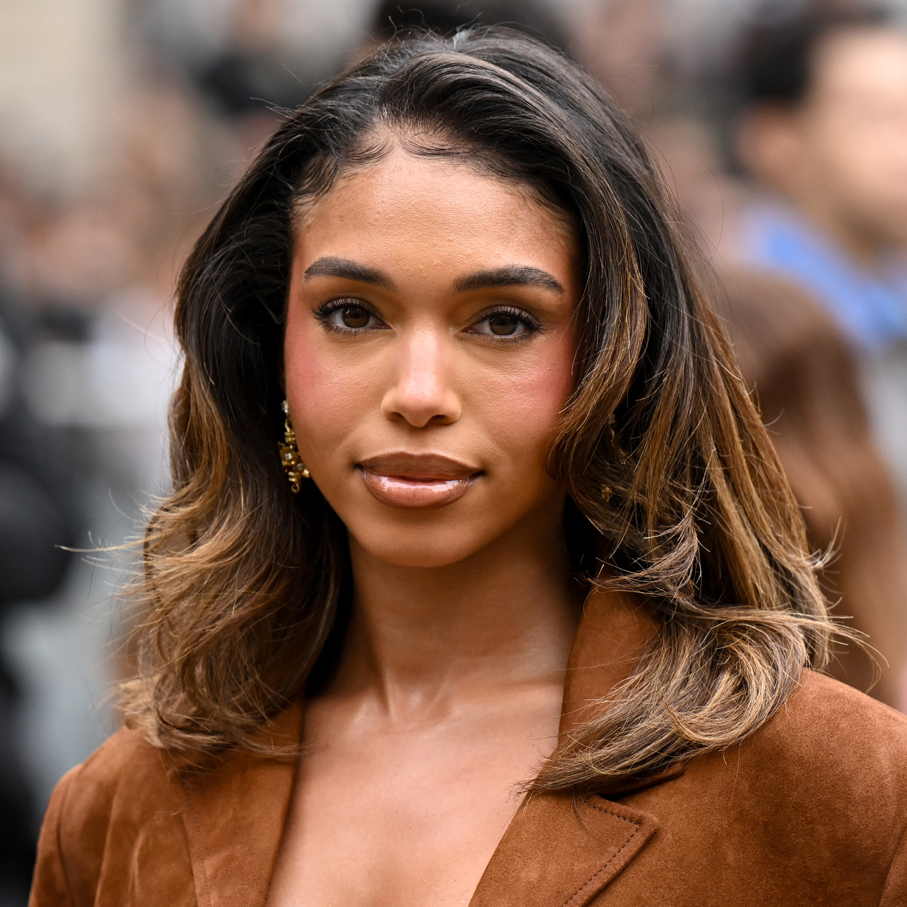 Lori Harvey attends the Miu Miu fashion show during the Spring/Summer 2026 Paris Fashion Week sporting a soft roller set