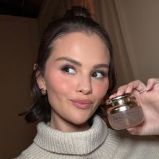 Selena Gomez holding Rare Beauty's new perfume