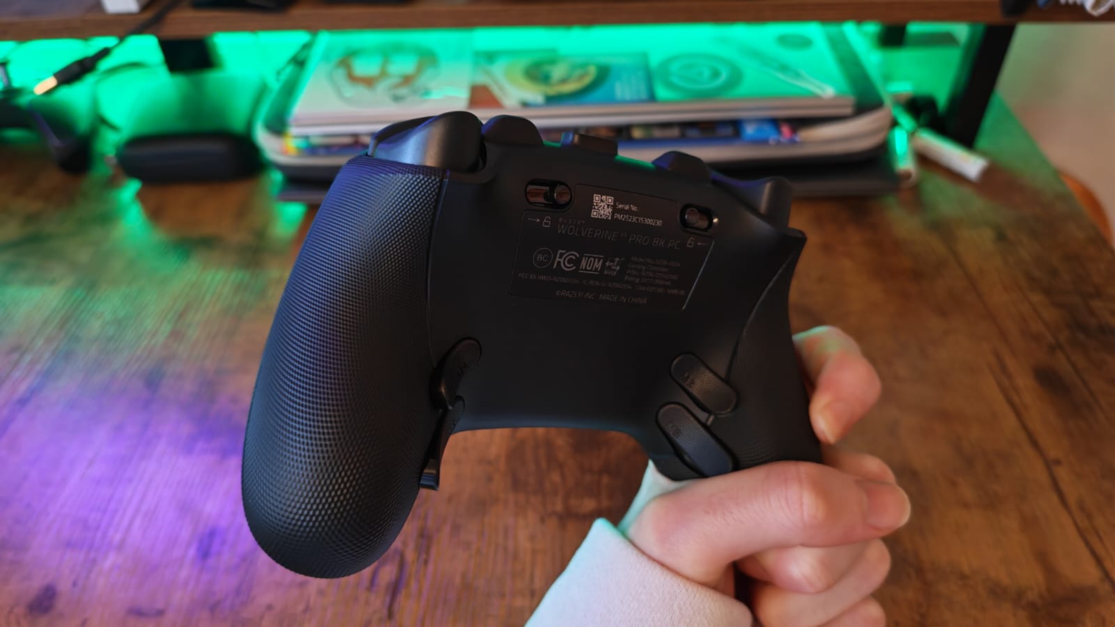The back of the Razer Wolverine V3 Pro 8K being held by a reviewer