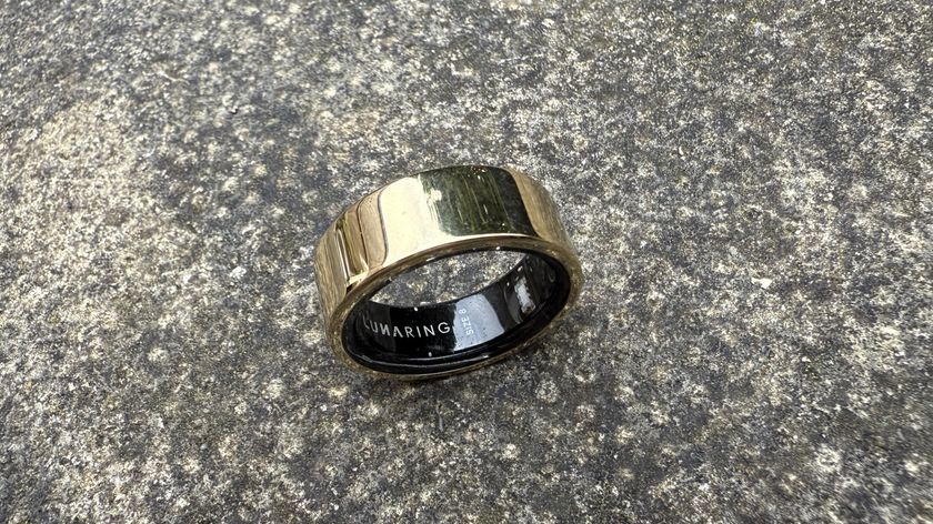 The Luna Ring 2 in Sunlit Gold against a concrete surface