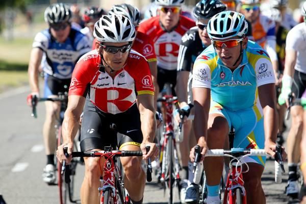 Robbie McEwen and Allan Davis chat during the ride this morning.