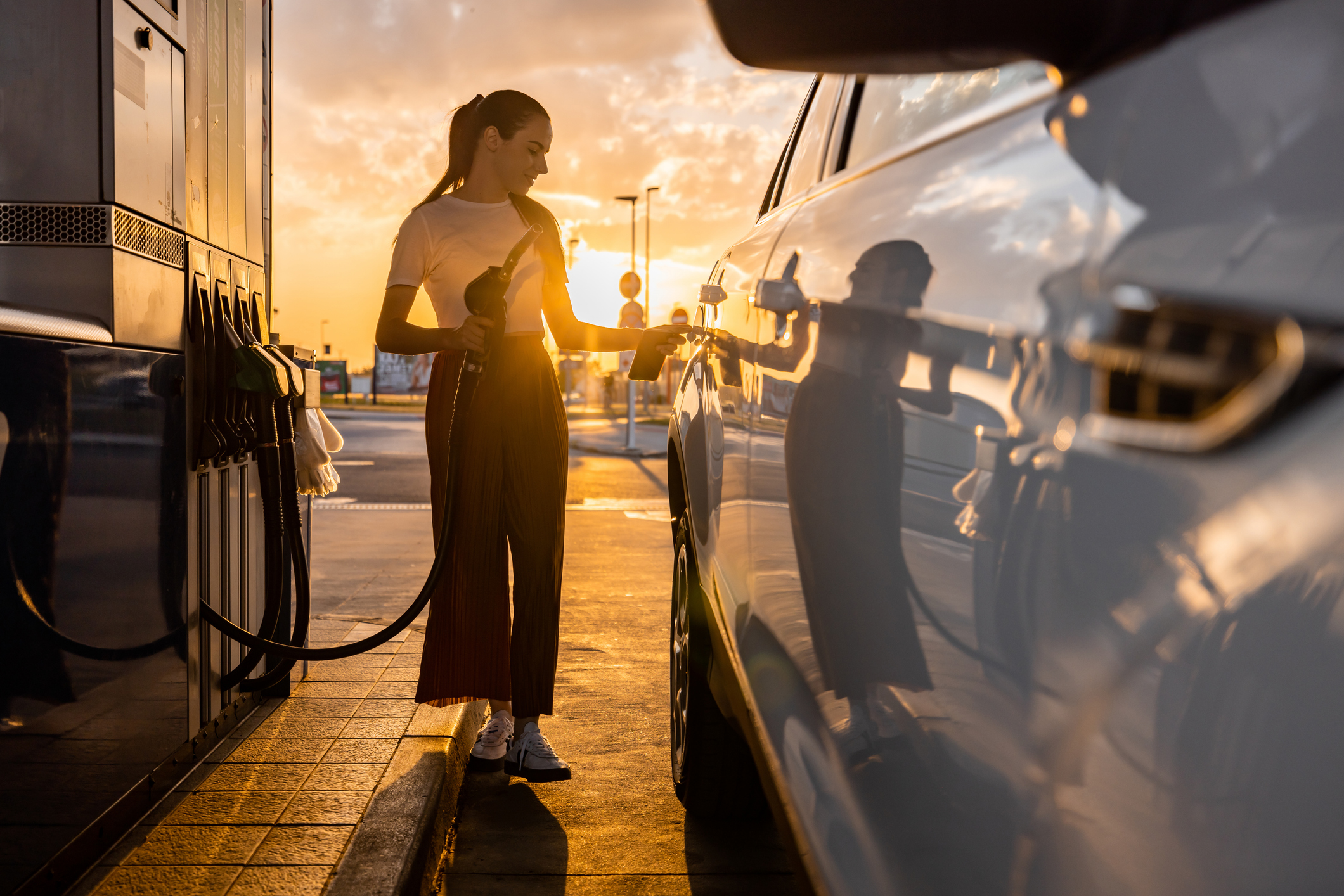 Woman refuelling car