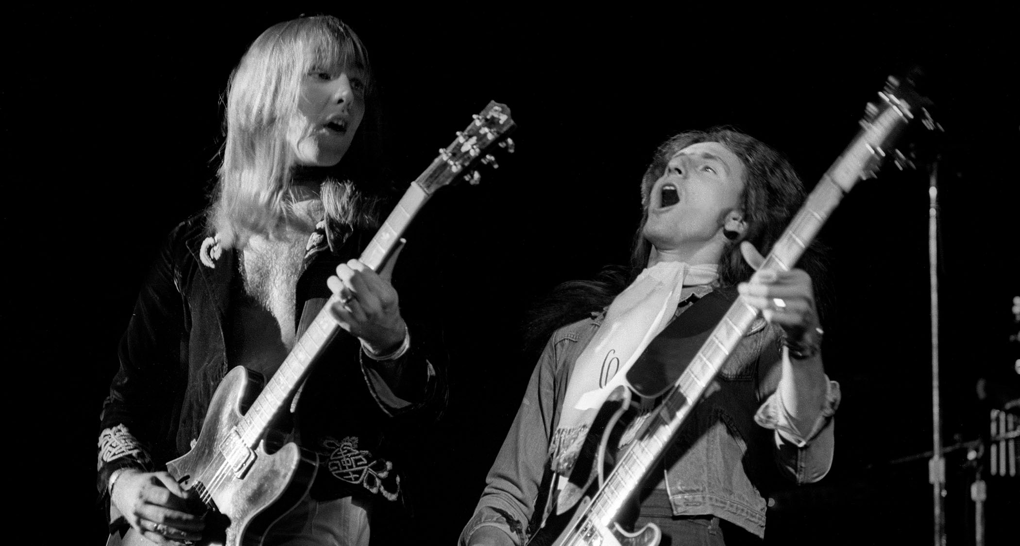 Rush perform live in 1978: This black-and-white live shot finds Alex Lifeson playing his Gibson ES-335 and Geddy Lee leaning back and playing his Rickenbacker bass
