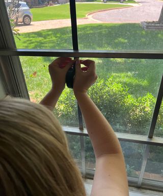 Dori Turner measuring window