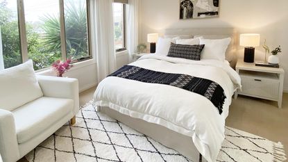 monochrome bedroom with bed and bedside lamps