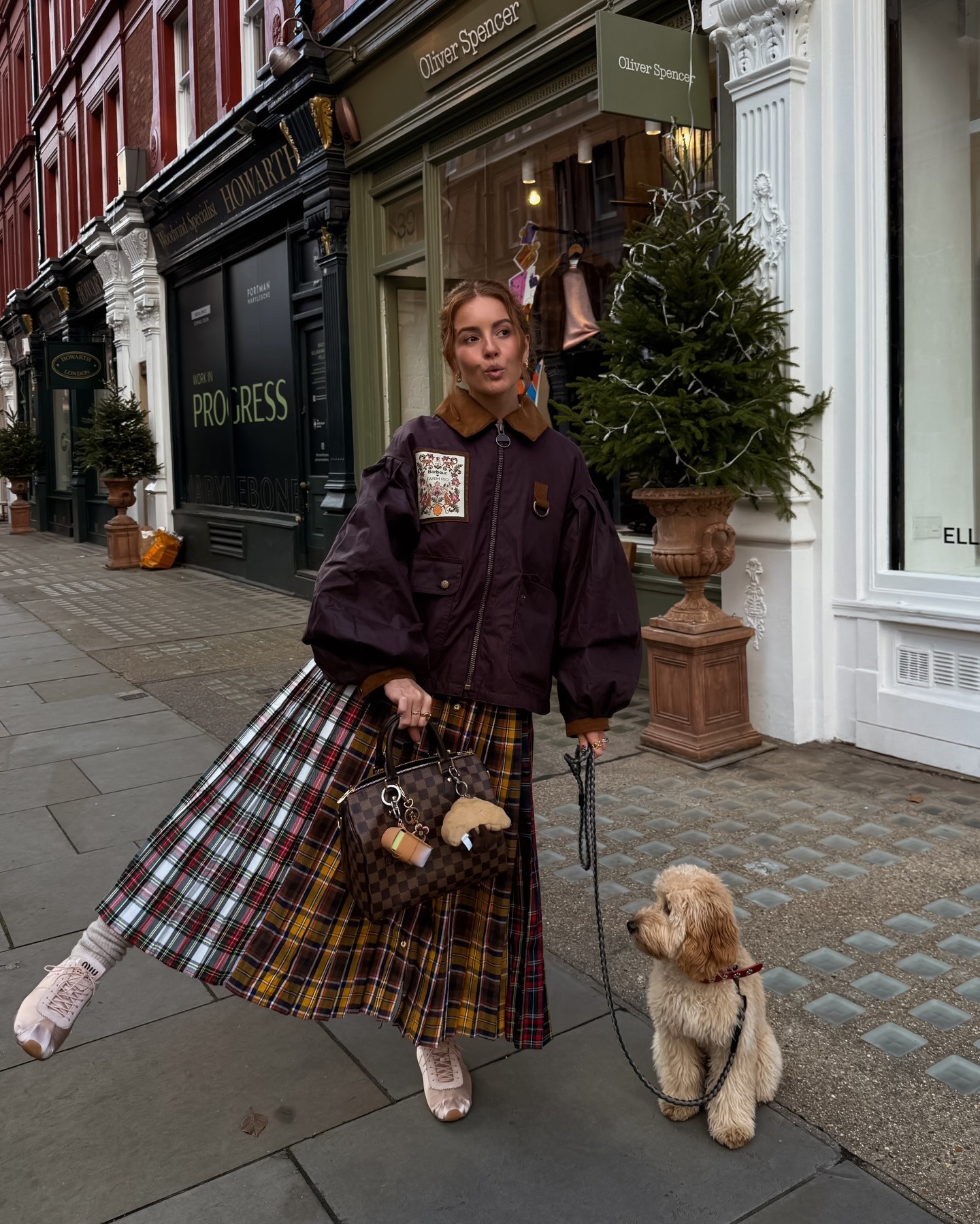 Fashion person Rebecca Ferraz Wyatt wears a london spring capsule wardrobe piece. She wears a pleated maxi skirt.