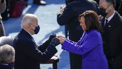 President Joe Biden fist bumps newly sworn-in Vice President Kamala Harris