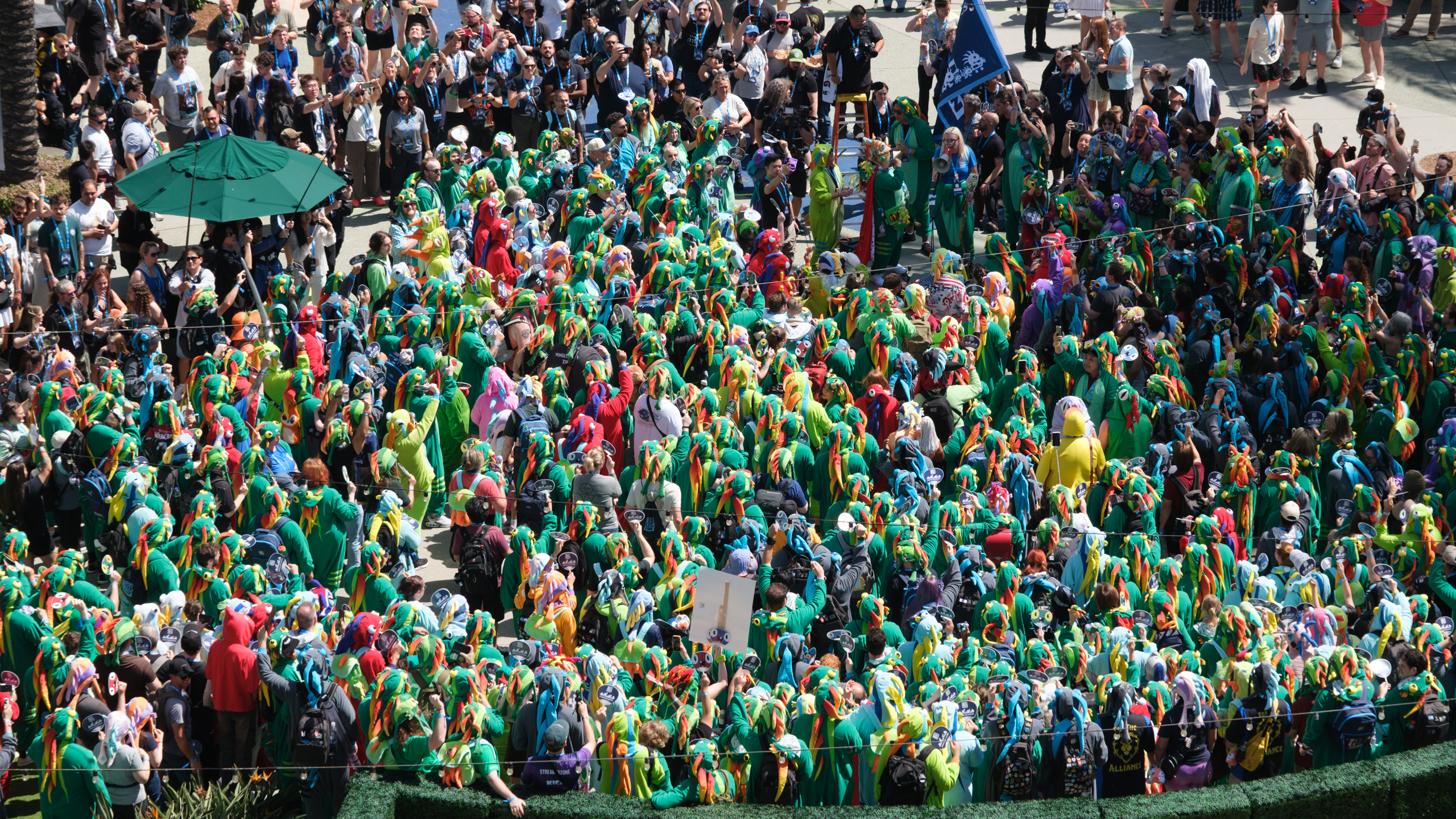 A big crowd wearing green Murloc outfits at BlizzCon 2026