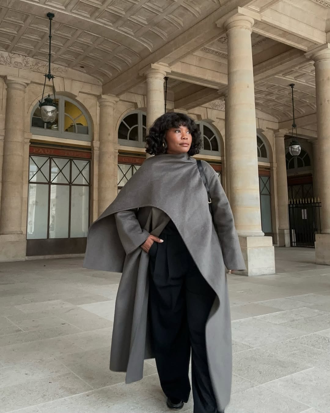 Franny Fyne wears a grey scarf coat