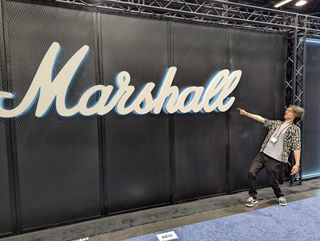 GW.com EIC Michael Astley-Brown stands in awe of the giant Marshall sign at the 2025 NAMM show in Anaheim, California