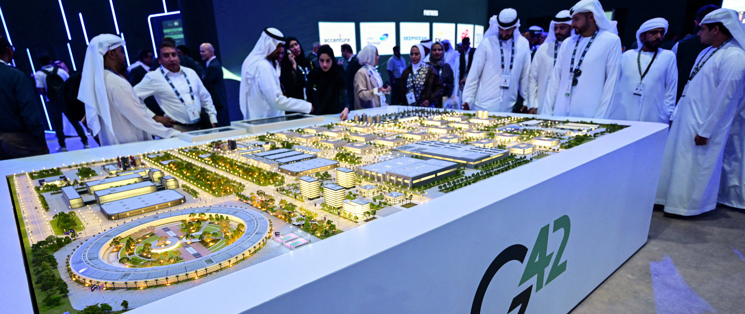 Guests look at a model of the largest data center in the UAE under construction in Abu Dhabi as the Stargate initiative.