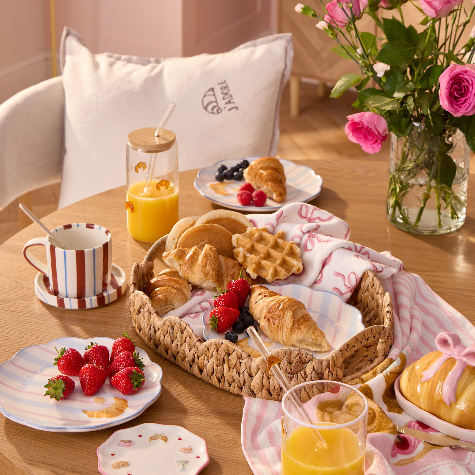 B&amp;amp;M Brunch Club tableware and pink roses on a table.