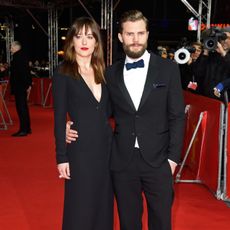 Fifty Shades Jamie Dornan & Dakota Johnson wearing black evening wear on the red carpet