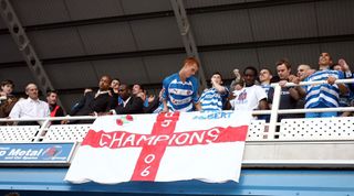 English Championship League match at the Madejski Stadium. Reading 5 v Derby County 0. Reading's resounding victory clinched the Championship title and automatic promotion to the Premier League, the first time they will have been in the top flight in their 135 year history. Jubilant Reading fans players celebrate in the stands with Steve Sidwell admiring a flag decorated with the word Champions. Left is manager Steve Coppell look on, 1st April 2006. (Photo by Eddie Greville/Mirrorpix/Getty Images)