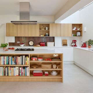 modular kitchen with white walls, wooden cabinets, and chimney