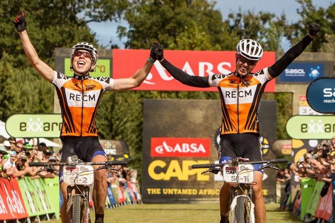 Winning ladies, Annika Langvad (L) and Ariane Kleinhans (R) cross the line of the final stage