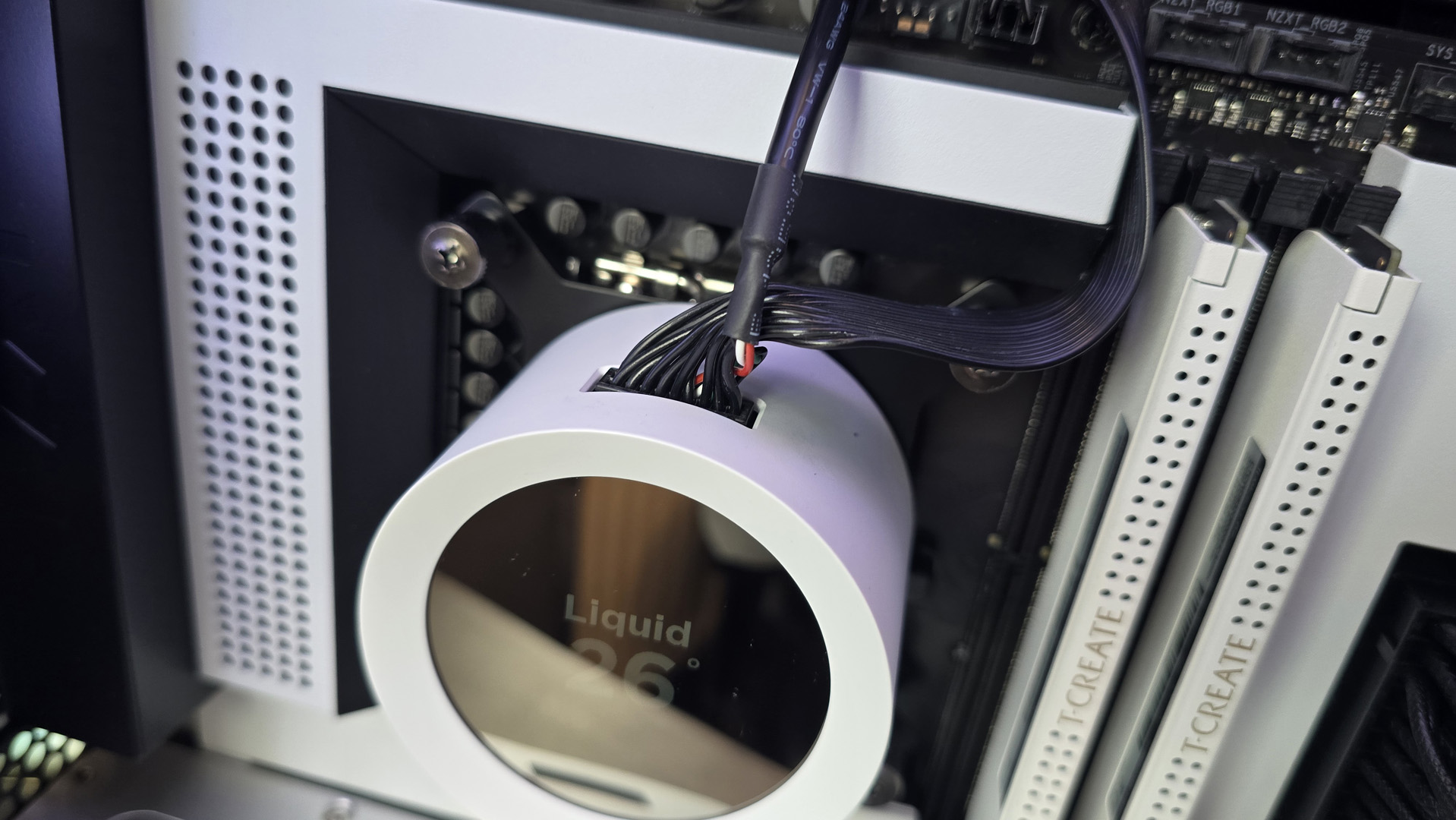 The NZXT Kraken Plus 360 RGB liquid cooler installed in a test bench.