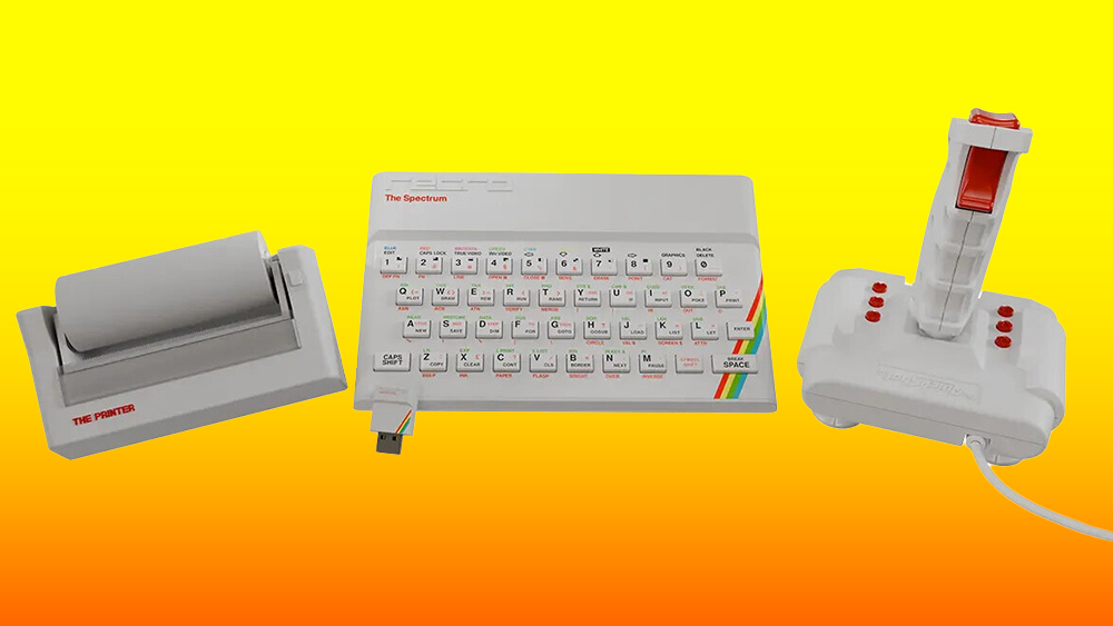 Product shot of new white ZX Spectrum replica with classic Spectrum joystick and other accessories