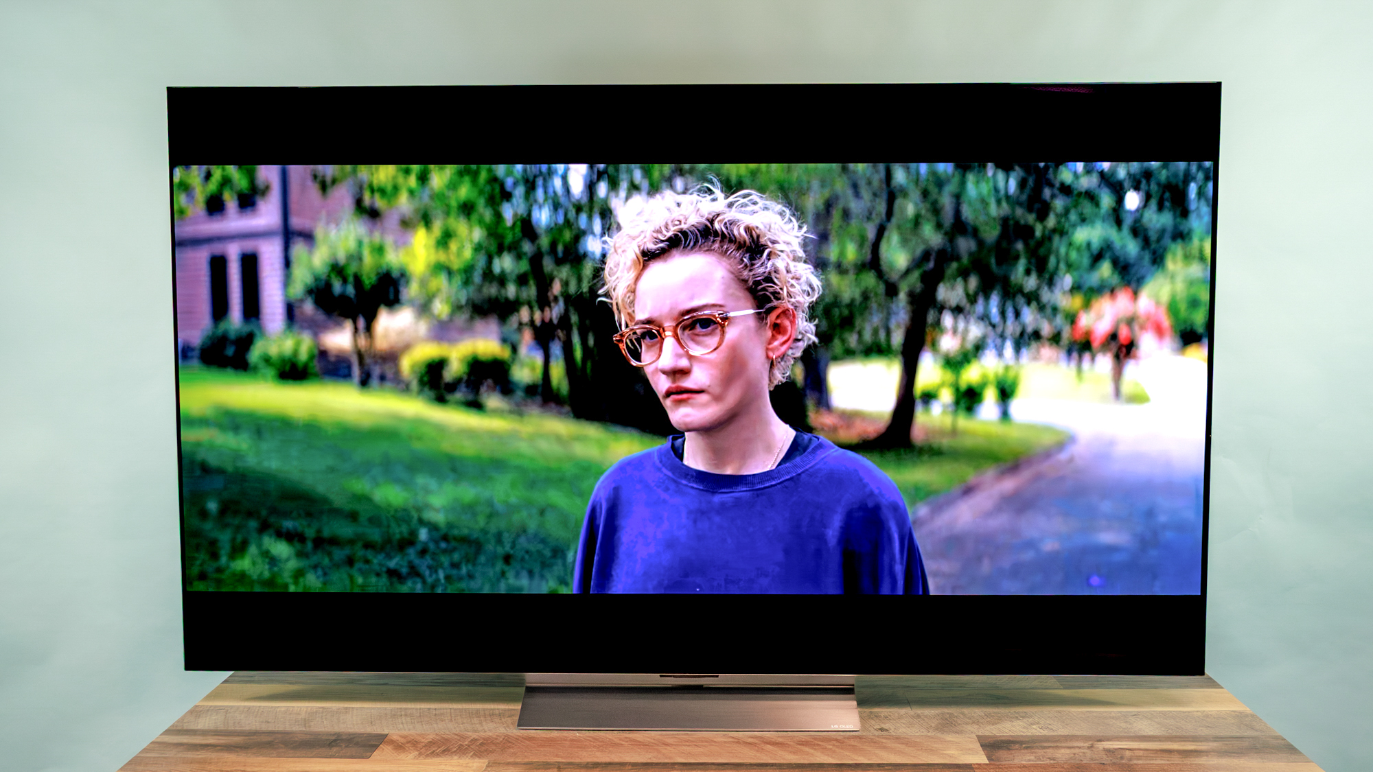 LG C6 OLED TV shown on a wood table