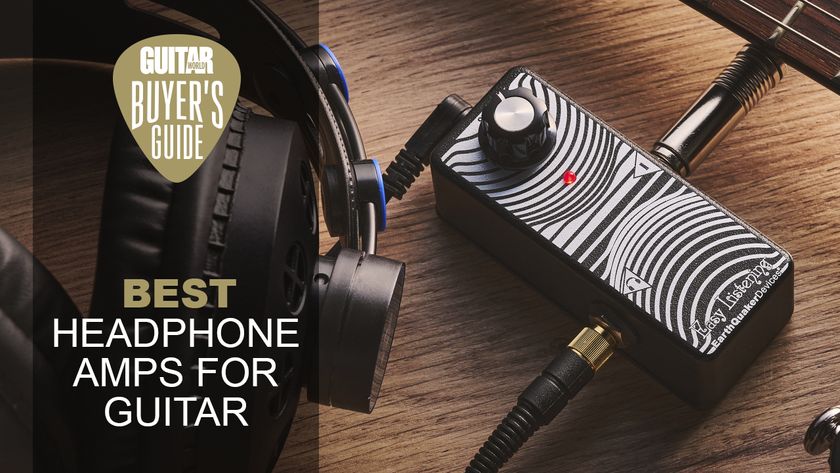 An Earthquaker Devices Easy Listening headphone amp for guitar on a wooden floor with a guitar and pair of headphones plugged in