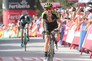 Simon Yates crosses the line to put time into his rivals