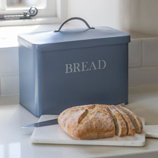 Bread Bin in Dorset Blue behind knife and loaf of bread on chopping board