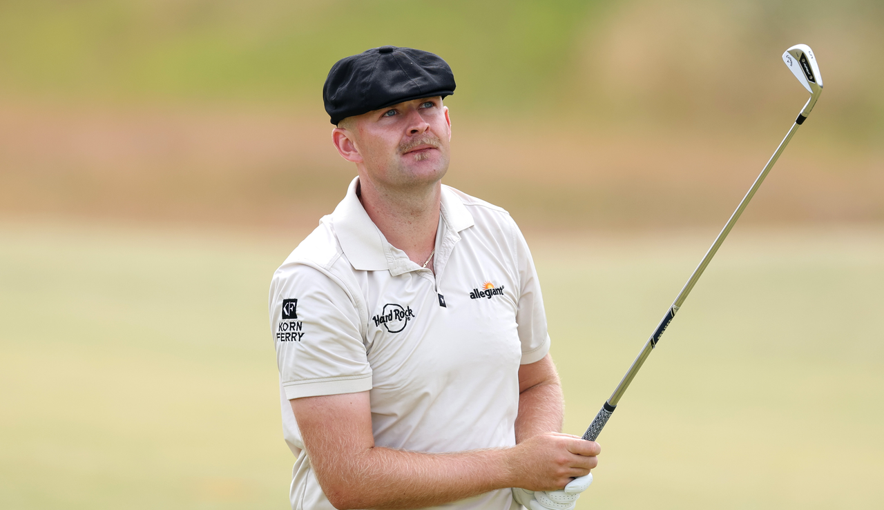 Harry Hall hits an iron and watches it in the air