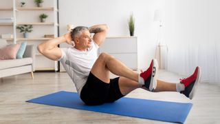 Man doing core workout on yoga mat