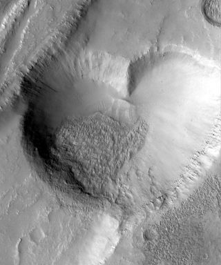 A heart-shaped pit on Mars sends a Valentine's greeting.