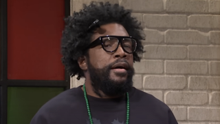 Questlove in the SNL sketch "Rap Roundtable"