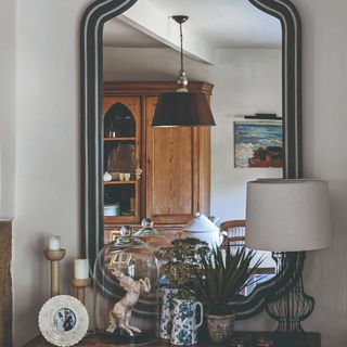 A large mirror hung above a console table
