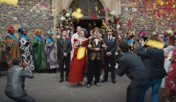 Rocketman Renate and Elton walking out of the church on their wedding day