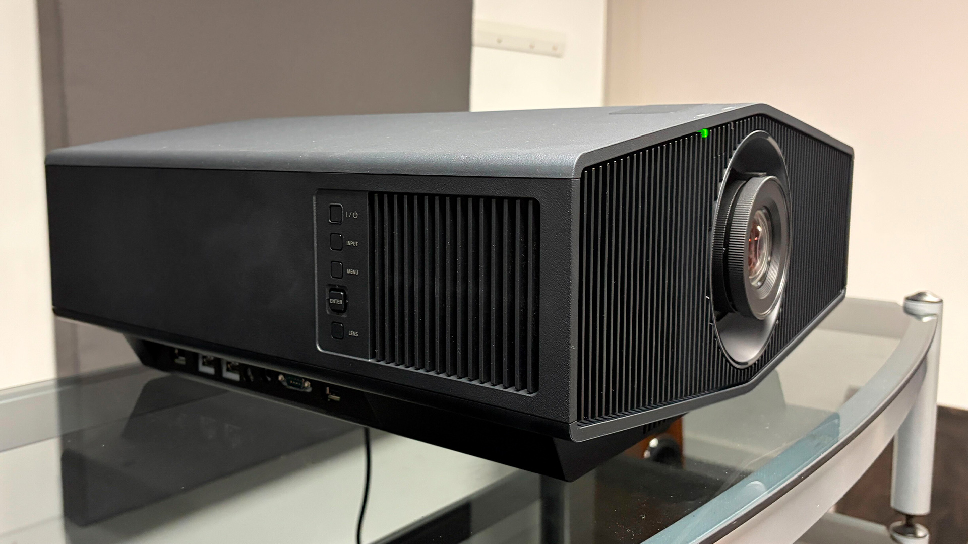 Sony Bravia Projector 7 home cinema projector on glass AV rack, slight side angle