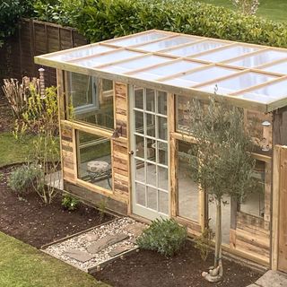 Re-using and recycling old discarded materials, former professional gardener Elizabeth Bloodworth created her own DIY greenhouse