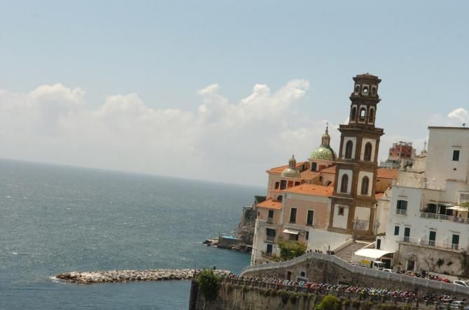 The Giro d'Italia peloton rolls along the Amalfi Coast