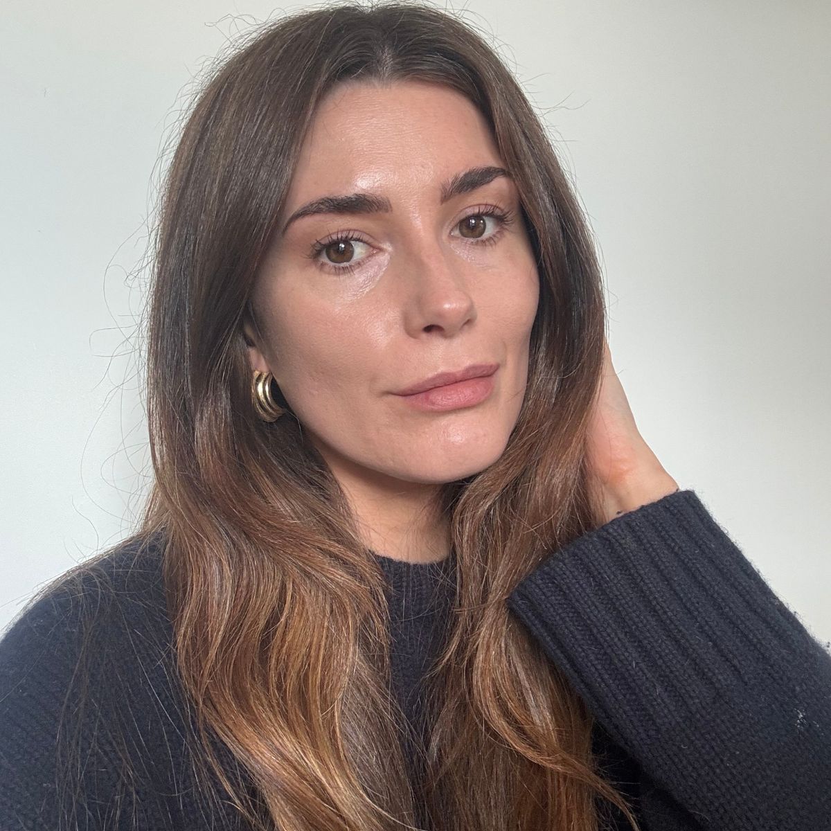 A photo of Eleanor wearing a navy jumper