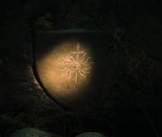 a stone chiseled "Inquisition Symbol" resembling the sword and eye of Dragon Age Inquisition