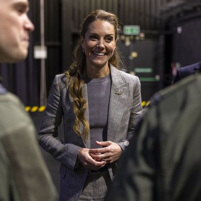 CONINGSBY, ENGLAND - OCTOBER 2: Catherine, Princess of Wales, Royal Honorary Air Commodore, meets Quick Reaction Alert personnel based at RAF Coningsby in Lincolnshire during her first official engagement at the station, on October 2, 2025 in Coningsby, England. During the visit, Her Royal Highness learned about the station's operational role, met Quick Reaction Alert personnel, viewed a Typhoon aircraft, and toured the new Typhoon Future Synthetic Training facility, and also met families of personnel serving at the base. (Photo by James Glossop - WPA Pool/Getty Images)
