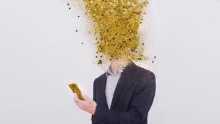 A person with a blown mind depicted with glitter