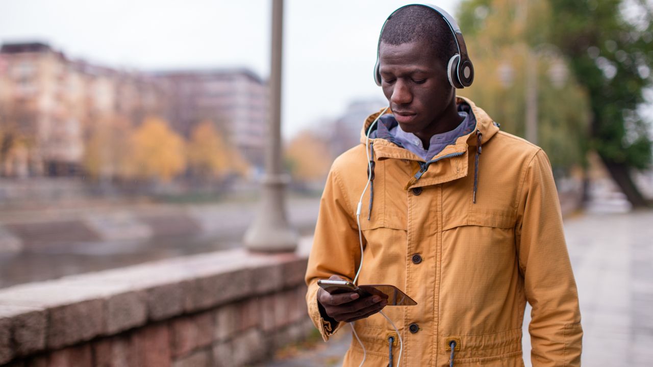 Man outside walking in fall