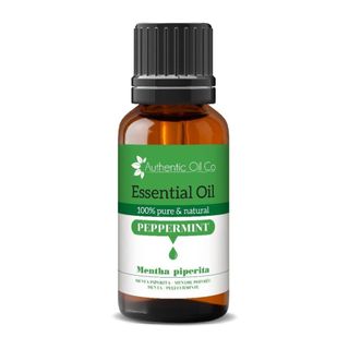 Brown bottle of Peppermint Essential Oil Pure and Natural on white background