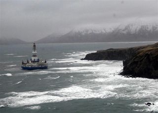 The Royal dutch Shell drill barge Kulluk grounded along Kodiak Island.