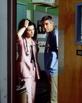 George Clooney and Julianna Margulies as doug and caroline an office at a hospital in er