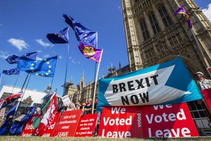 Demonstrators for and against Brexit protest outside the Houses of Parliament in London, U.K., on Wednesday, Sept. 4, 2019. U.K. Prime Minister Boris Johnson suffered an historic defeat in Pa