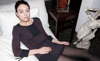 Woman in short knitted long sleeved dress