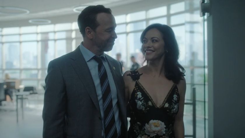 From left to right: Donnie Wahlberg as Danny Reagan and Marisa Ramirez as Maria Baez walking out while linked together in Boston Blue. 