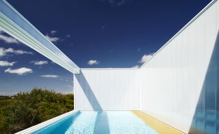The pool to a sliding panel that hides a ‘secret garden’