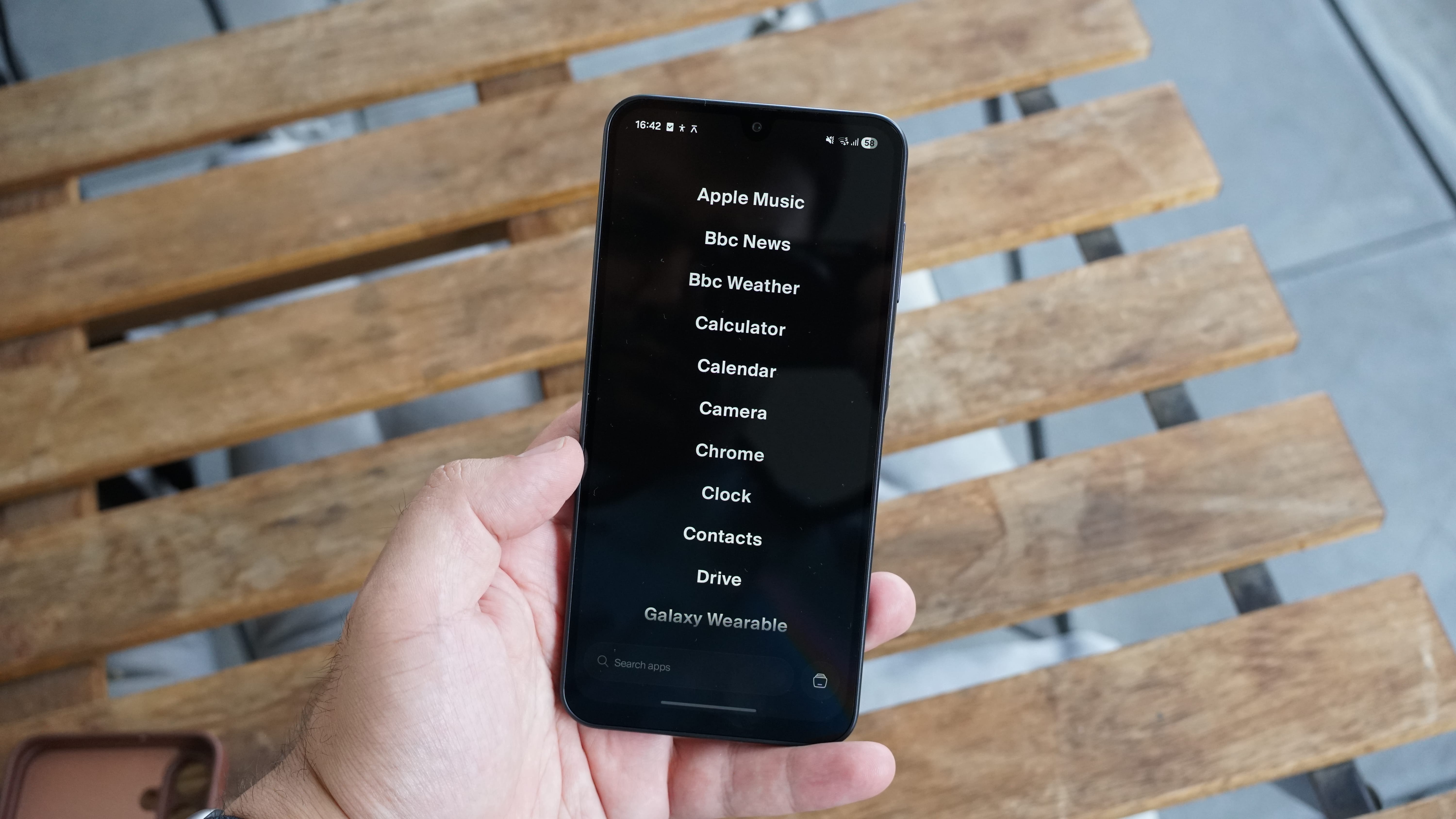 The Balance Phone being held in the hand