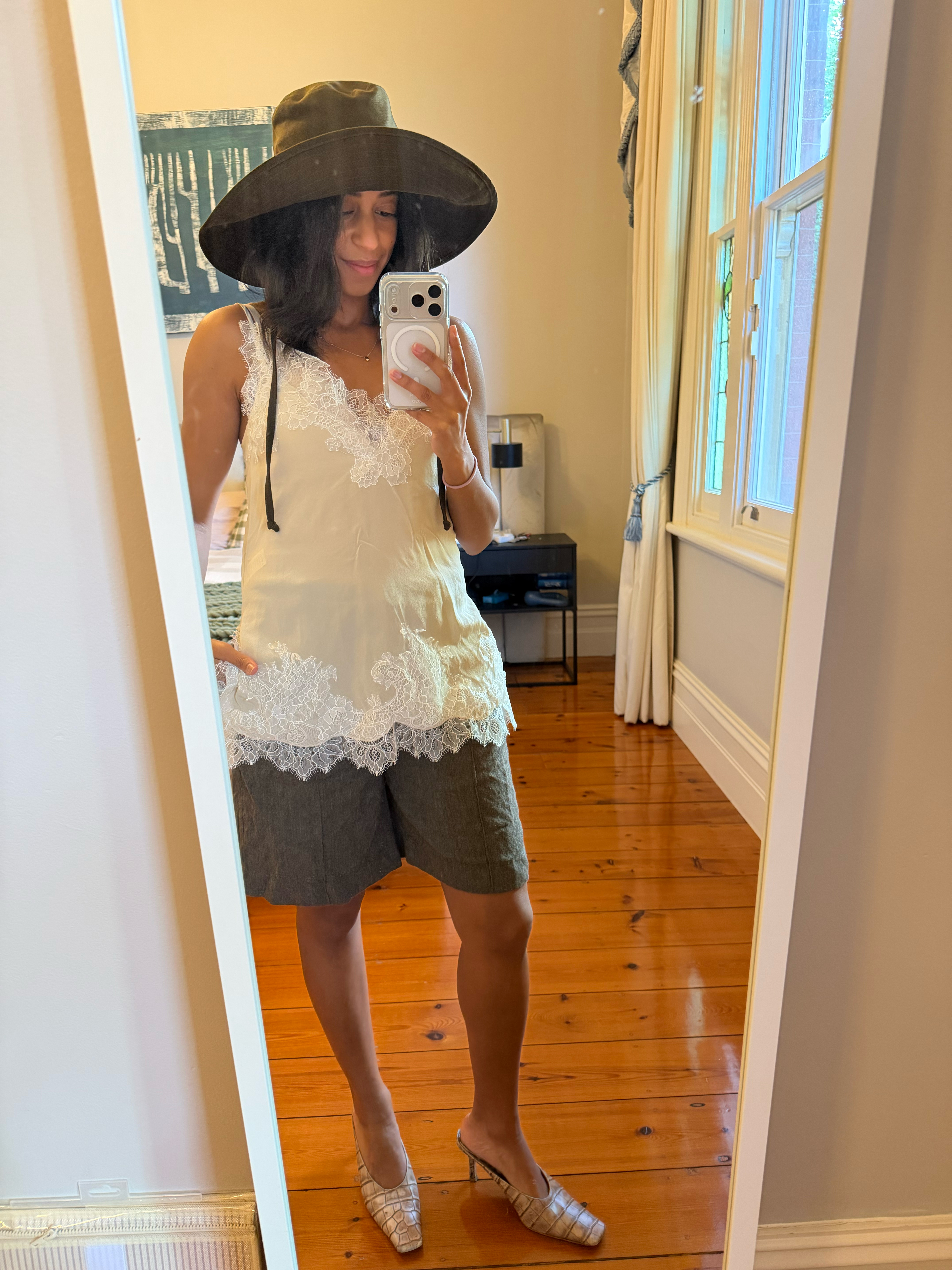 cathy karuga wearing green hat